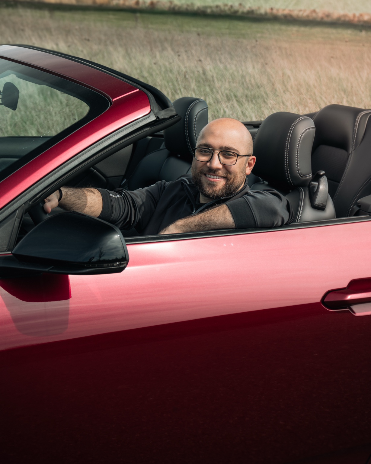 Khalid in a Ford Mustang convertible